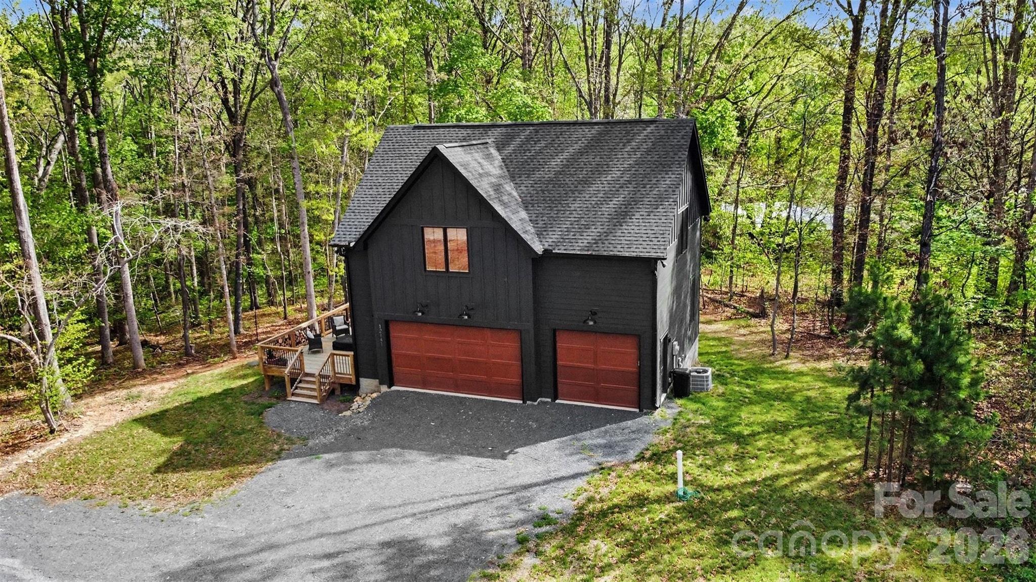 12141 Coyle Road Stanfield, NC 28163 - Photo 25 of 26 a front view of a house with a yard