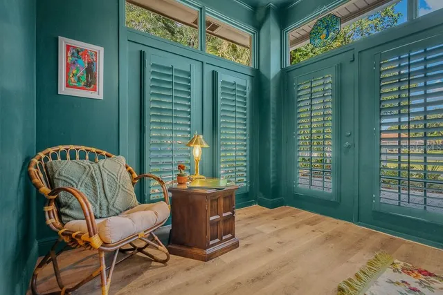 a balcony with table and chairs