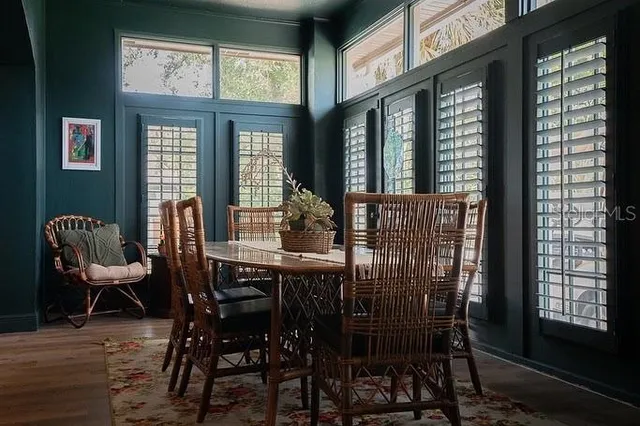 a view of a dining room with furniture window and outside view