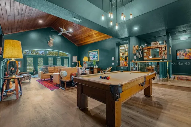 a view of a patio with a table and chairs