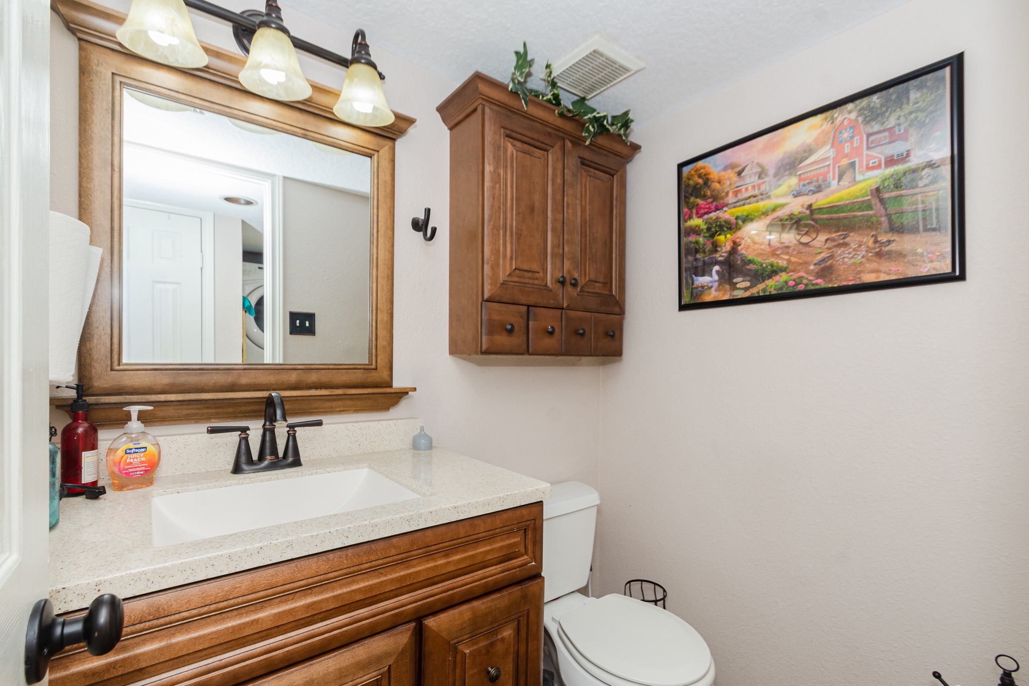 3625 County Road 36 Angleton, TX 77515 - Photo 19 of 50 a bathroom with a toilet sink and mirror