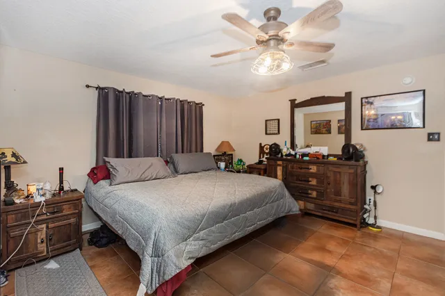 a bed room with a bed and a chandelier