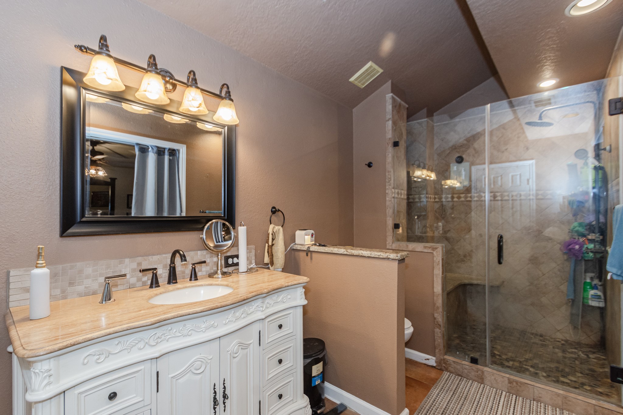 3625 County Road 36 Angleton, TX 77515 - Photo 22 of 50 a bathroom with a granite countertop sink mirror and shower