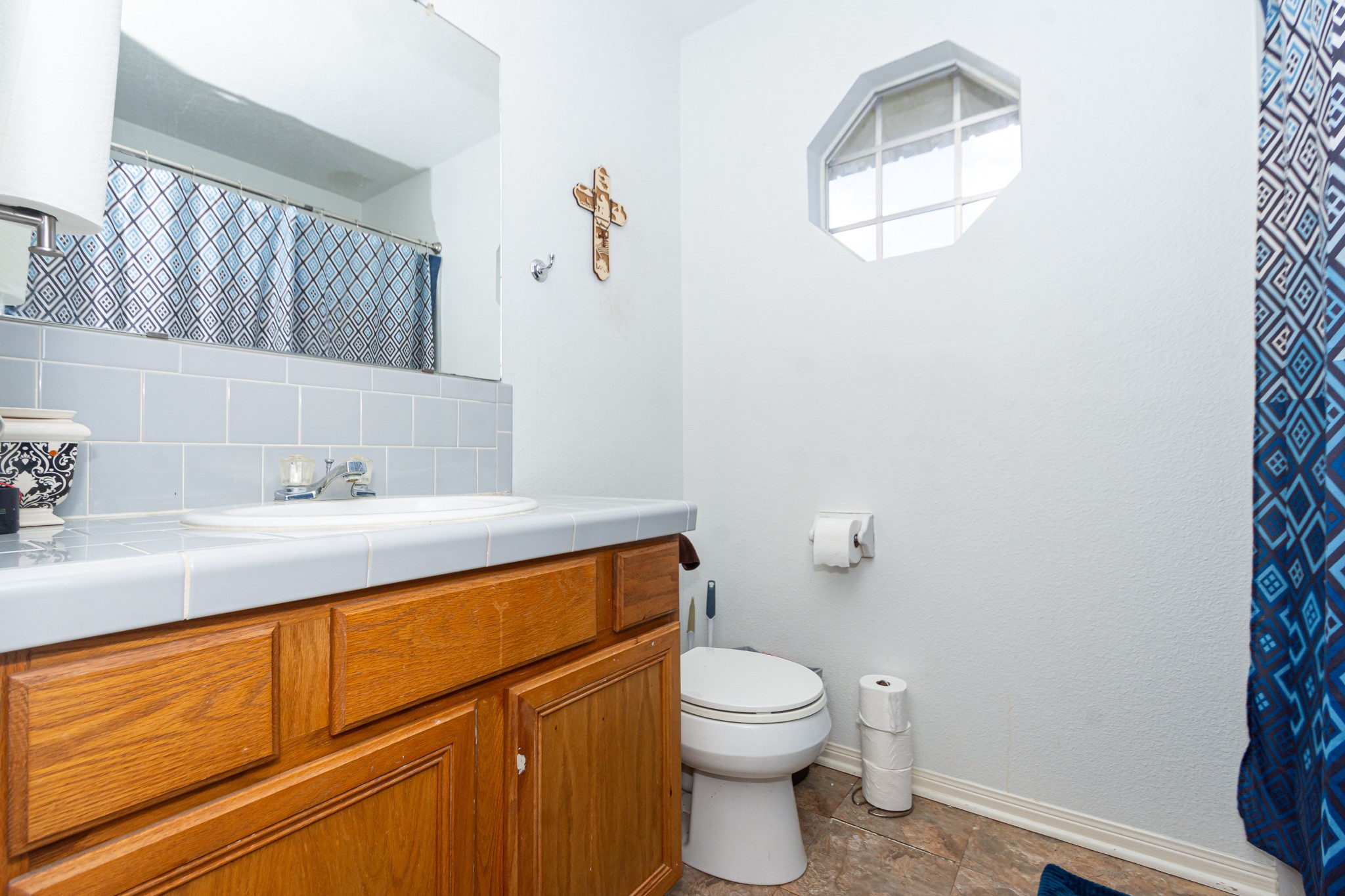 3625 County Road 36 Angleton, TX 77515 - Photo 26 of 50 a bathroom with a sink a toilet and a mirror