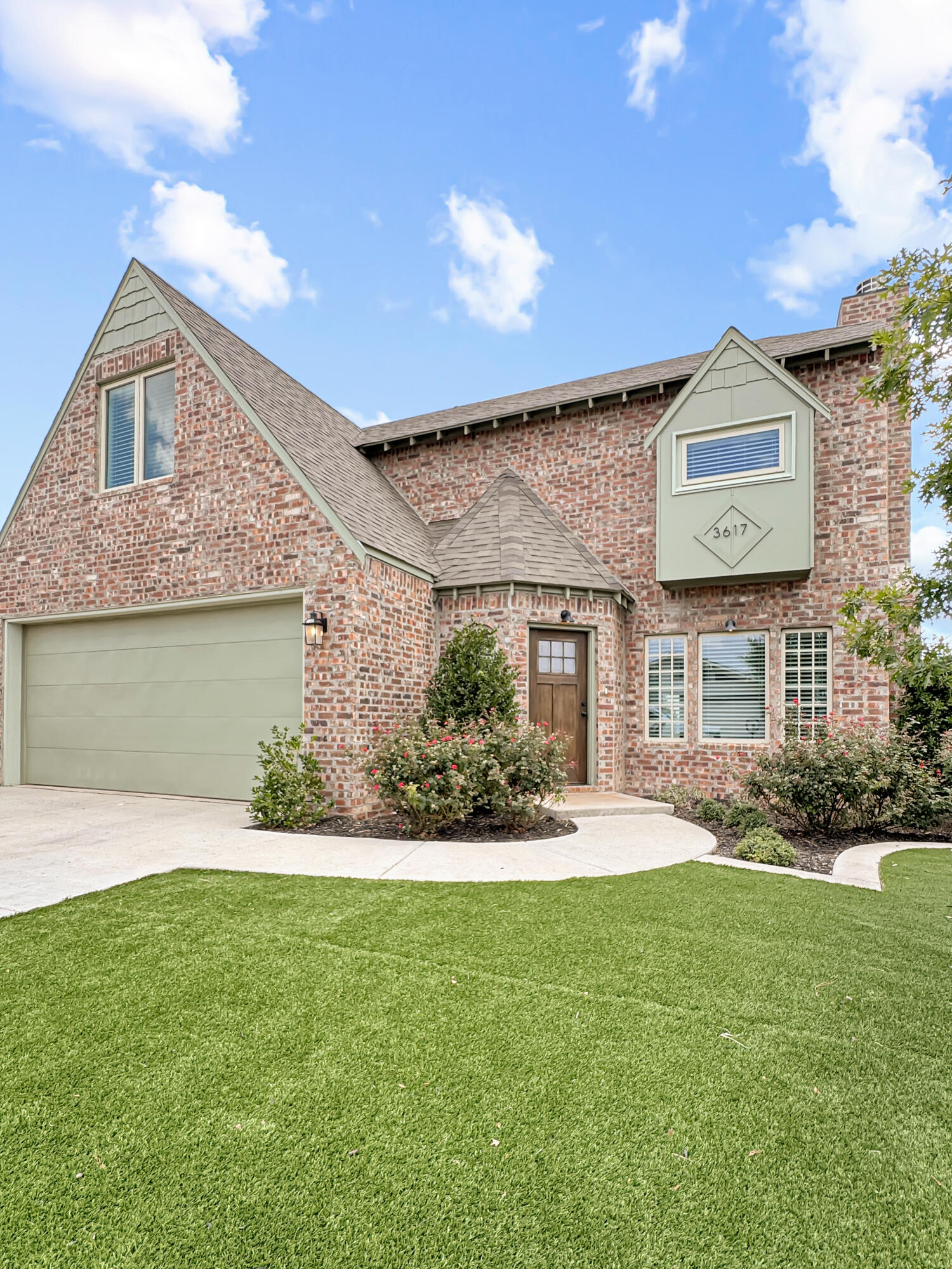 3617 128th Street Lubbock, TX 79423 - Photo 1 of 30 a front view of a house with a yard and garage