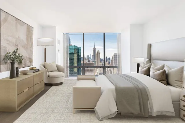 a bed room with a bed and a large window