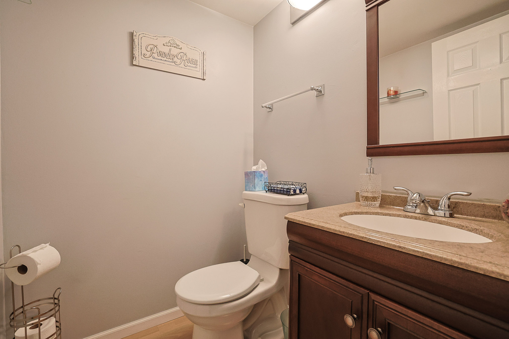 830 Hawk Lane Carol Stream, IL 60188 - Photo 11 of 30 a bathroom with a granite countertop toilet sink and mirror