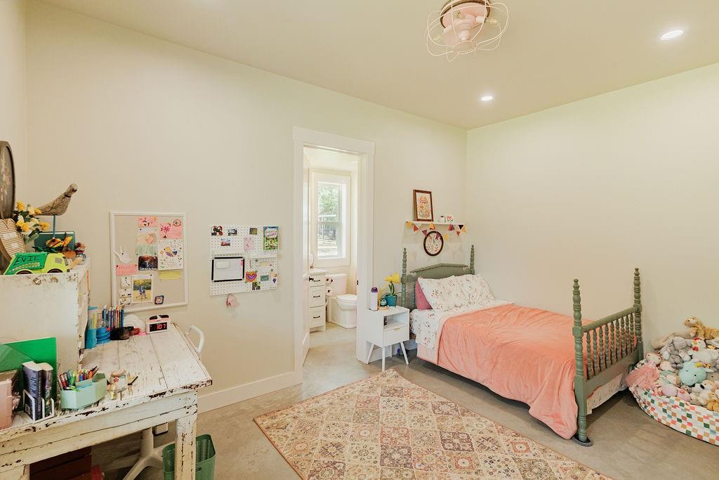 2094 Jim Harry Loop Sunset, TX 76270 - Photo 20 of 40 second primary bedroom on first floor with en suite full bathroom