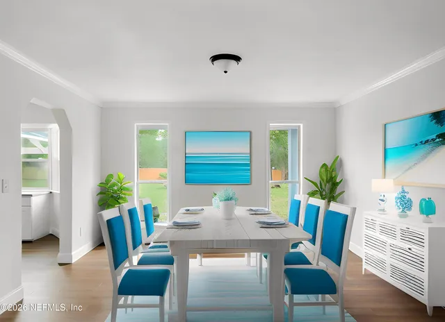 an empty room with wooden floor fan and window