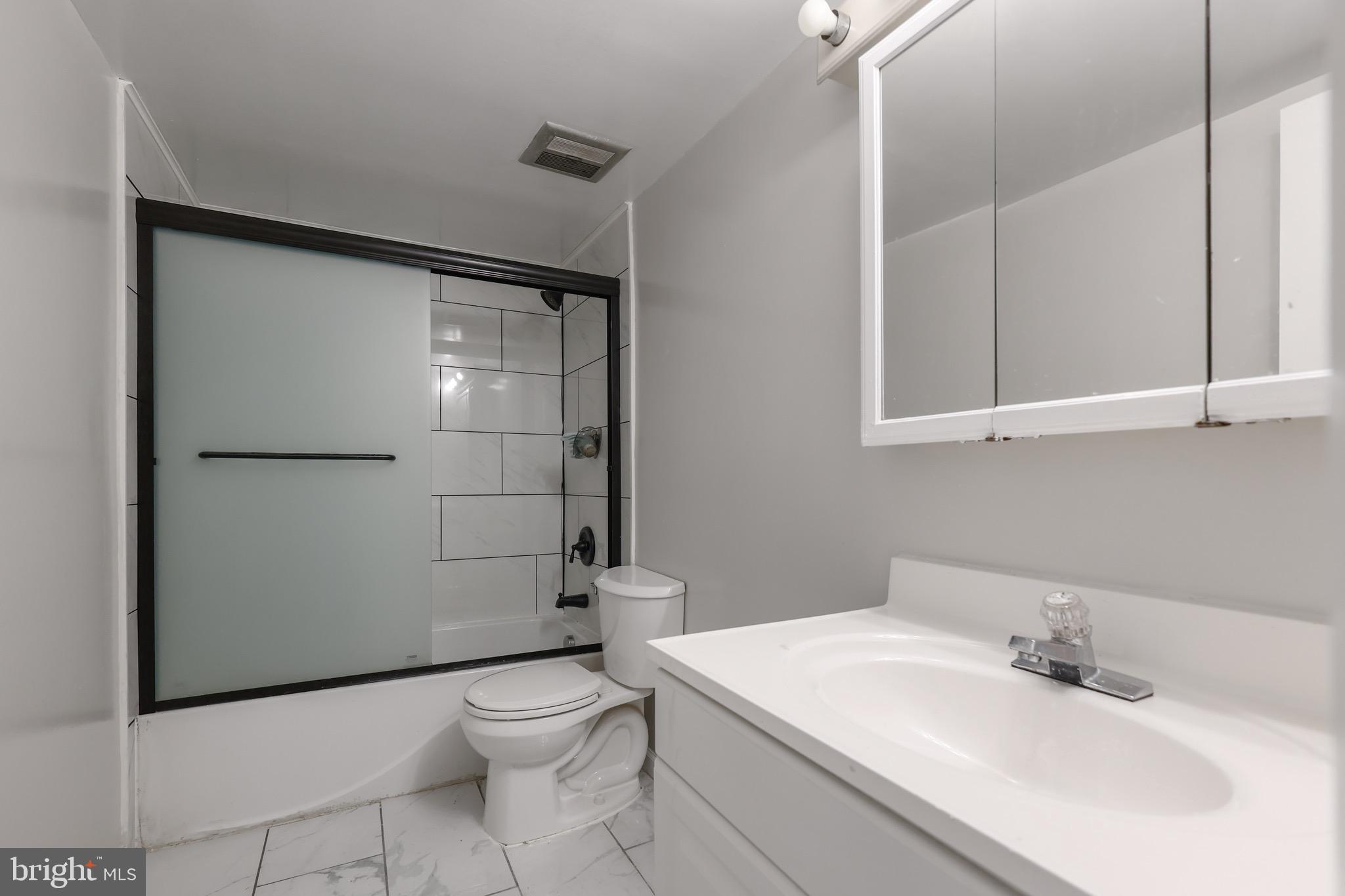 5050 7th Road South, Unit 301 Arlington, VA 22204 - Photo 12 of 20 a bathroom with a sink a toilet and shower