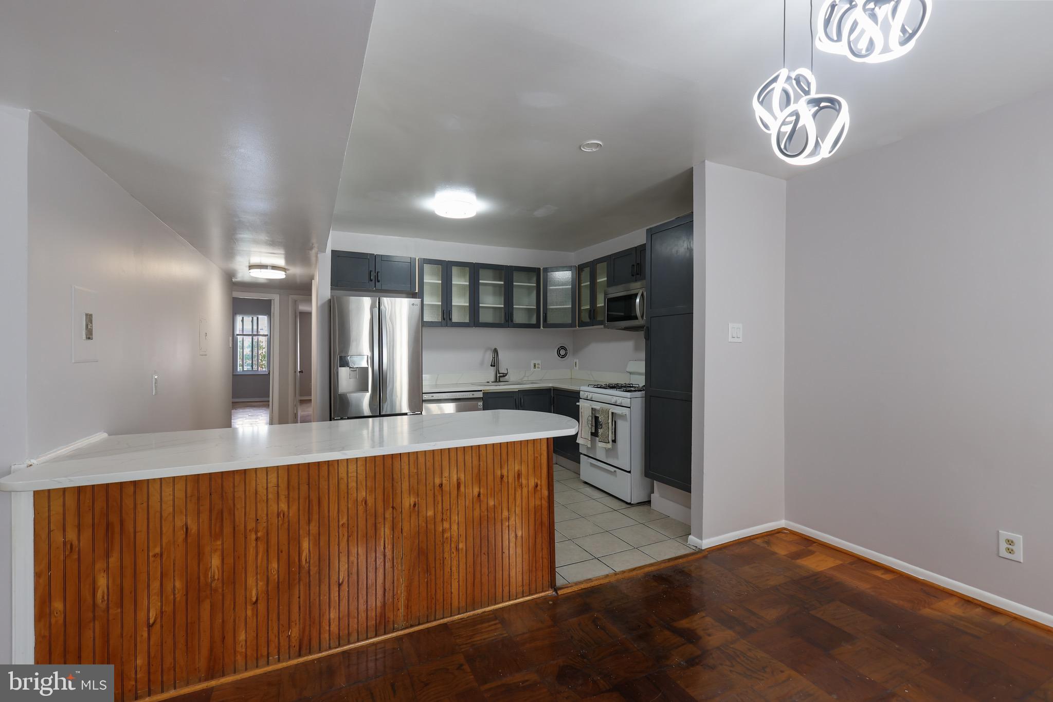 5050 7th Road South, Unit 301 Arlington, VA 22204 - Photo 7 of 20 a view of a kitchen with a stove
