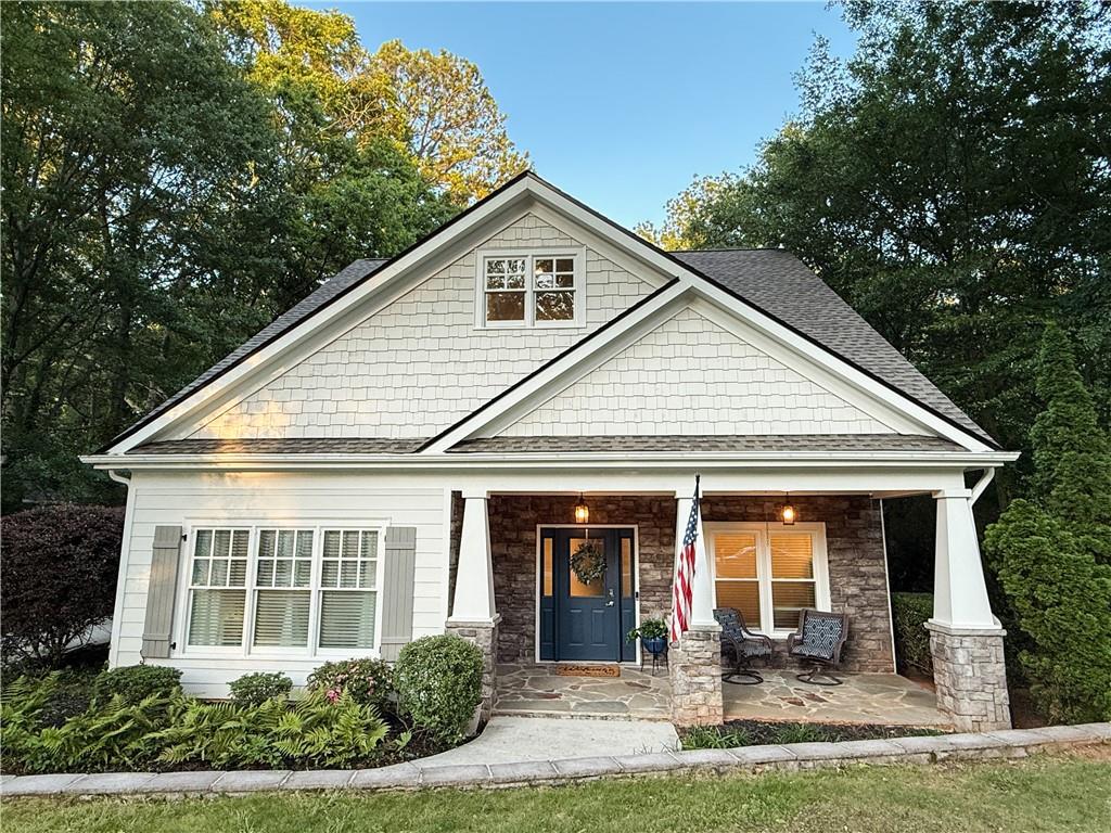 a front view of a house with garden