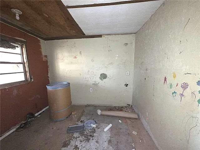 an empty room with windows