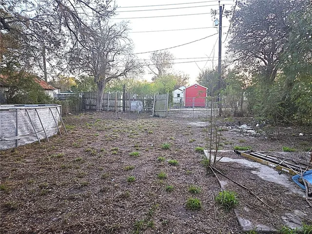 a kitchen with a sink window and cabinets