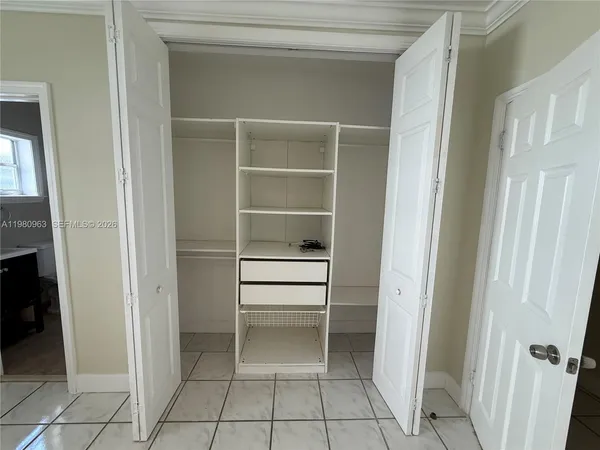 a view of an empty walk in closet