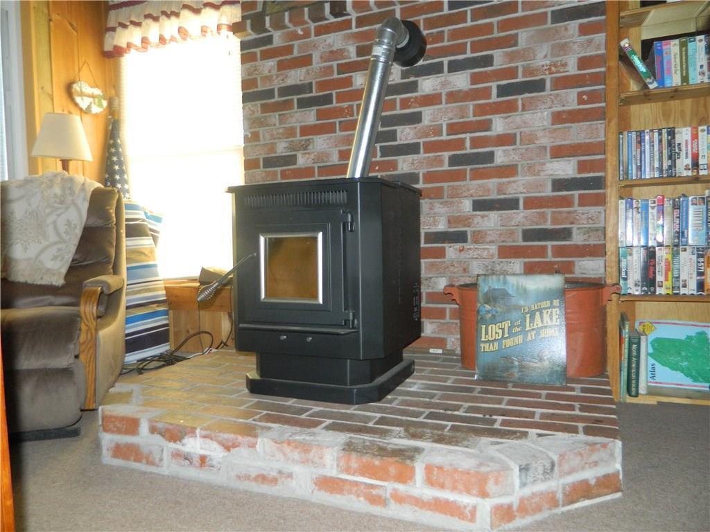 74 Cottage Road Limerick, ME 04048 - Photo 11 of 24 Pellet stove/hearth area in living room