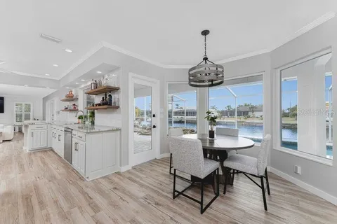 a kitchen with granite countertop cabinets stainless steel appliances and sink