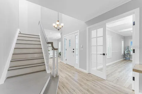 a bathroom with a double vanity sink mirror and toilet