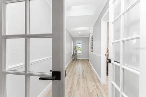 a spacious bedroom with a bed and a table in it