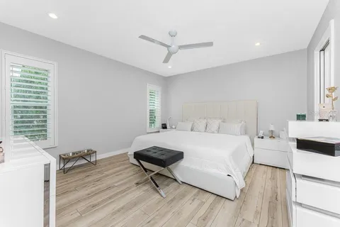 a bedroom with a bed and a couch