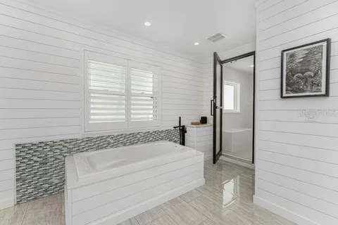 a bathroom with a double vanity sink mirror and double