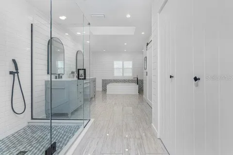a view of a patio with a dining table and chairs
