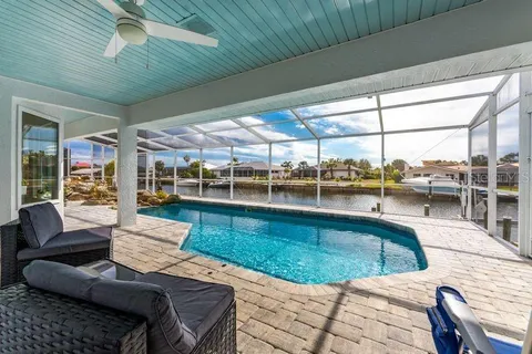 a view of a swimming pool with a patio