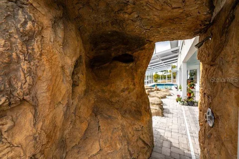 an aerial view of a house with outdoor space