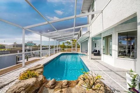 an aerial view of a house with outdoor space