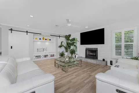 a view of living room with furniture and flat screen tv