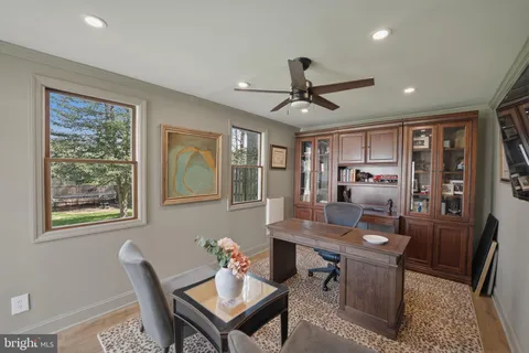 a workspace with furniture and window