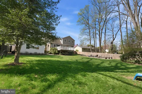 a front view of a house with a yard table and chairs