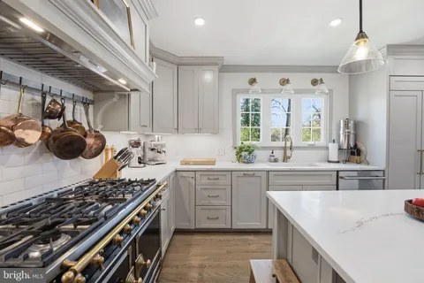 a kitchen with a stove and a sink
