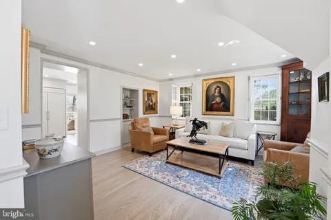 a living room with furniture rug and window