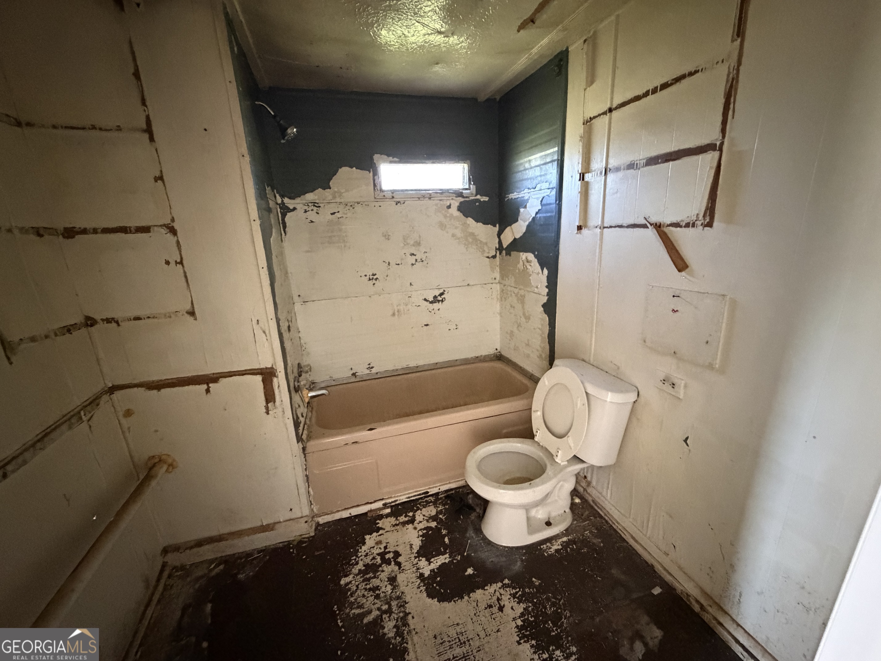 265 Aldora Street Barnesville, GA 30204 - Photo 7 of 9 a bathroom with a toilet and a shower