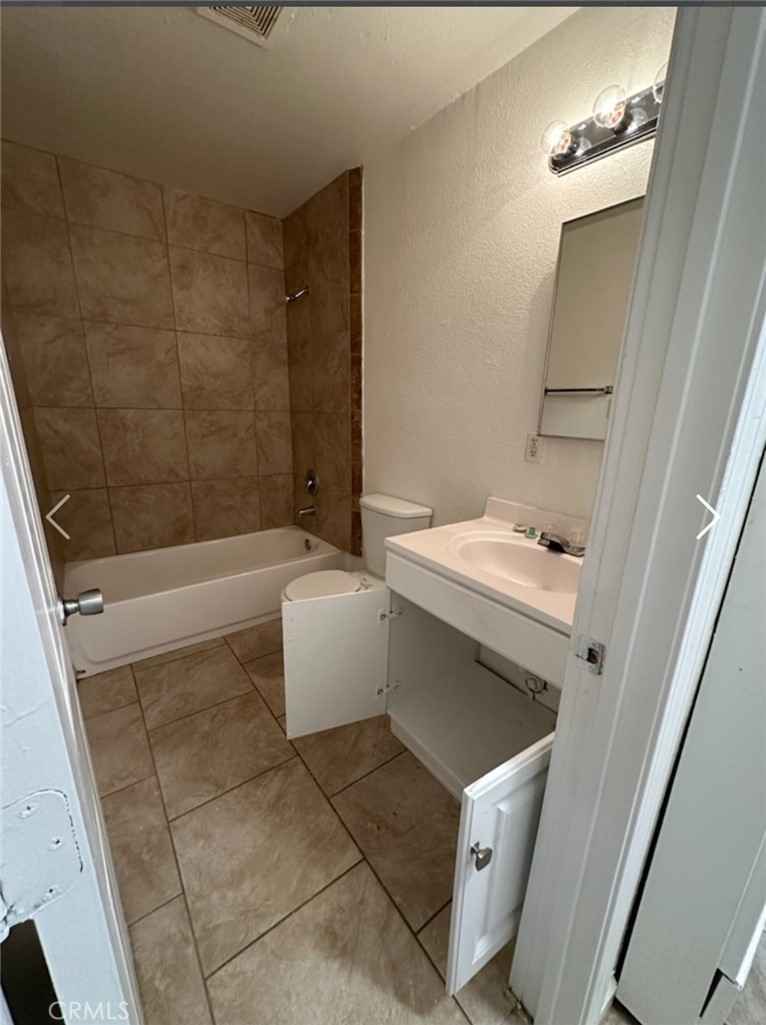 11895 White Avenue Adelanto, CA 92301 - Photo 20 of 21 a bathroom with a sink a toilet and shower