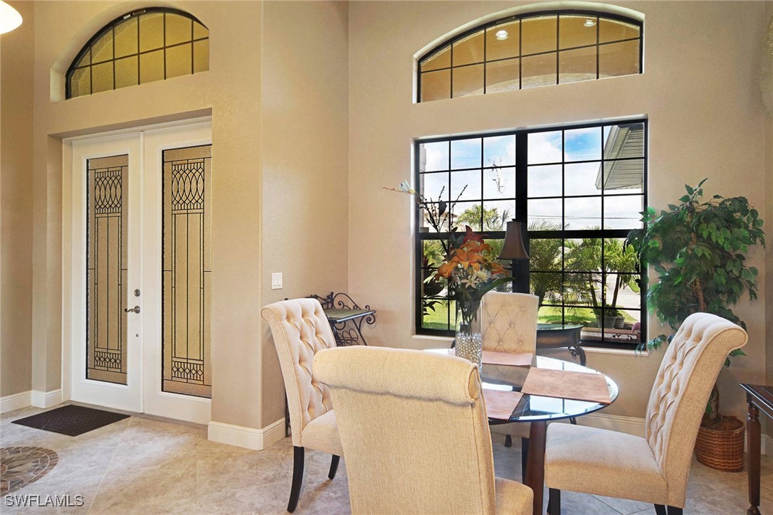 1502 Southwest 38th Street Cape Coral, FL 33914 - Photo 11 of 17 a view of a dining room with furniture window and outside view