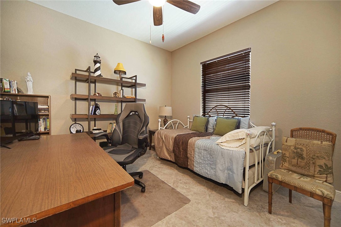 1502 Southwest 38th Street Cape Coral, FL 33914 - Photo 16 of 17 a bedroom with bed and a chandelier