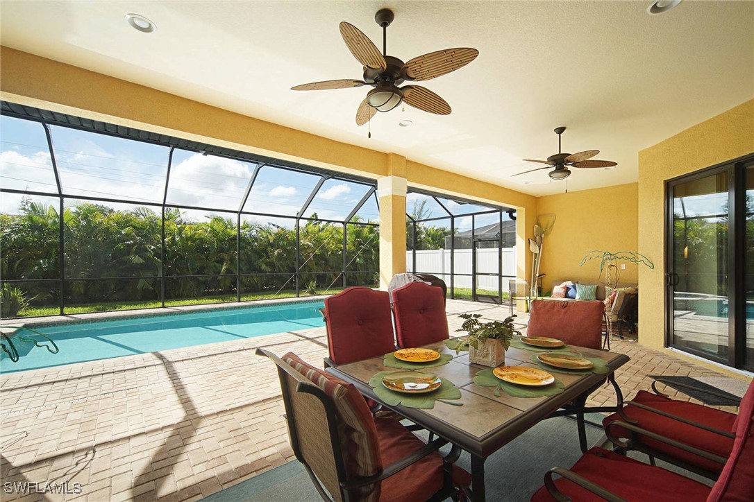1502 Southwest 38th Street Cape Coral, FL 33914 - Photo 4 of 17 a view of a dining room with furniture window and outside view