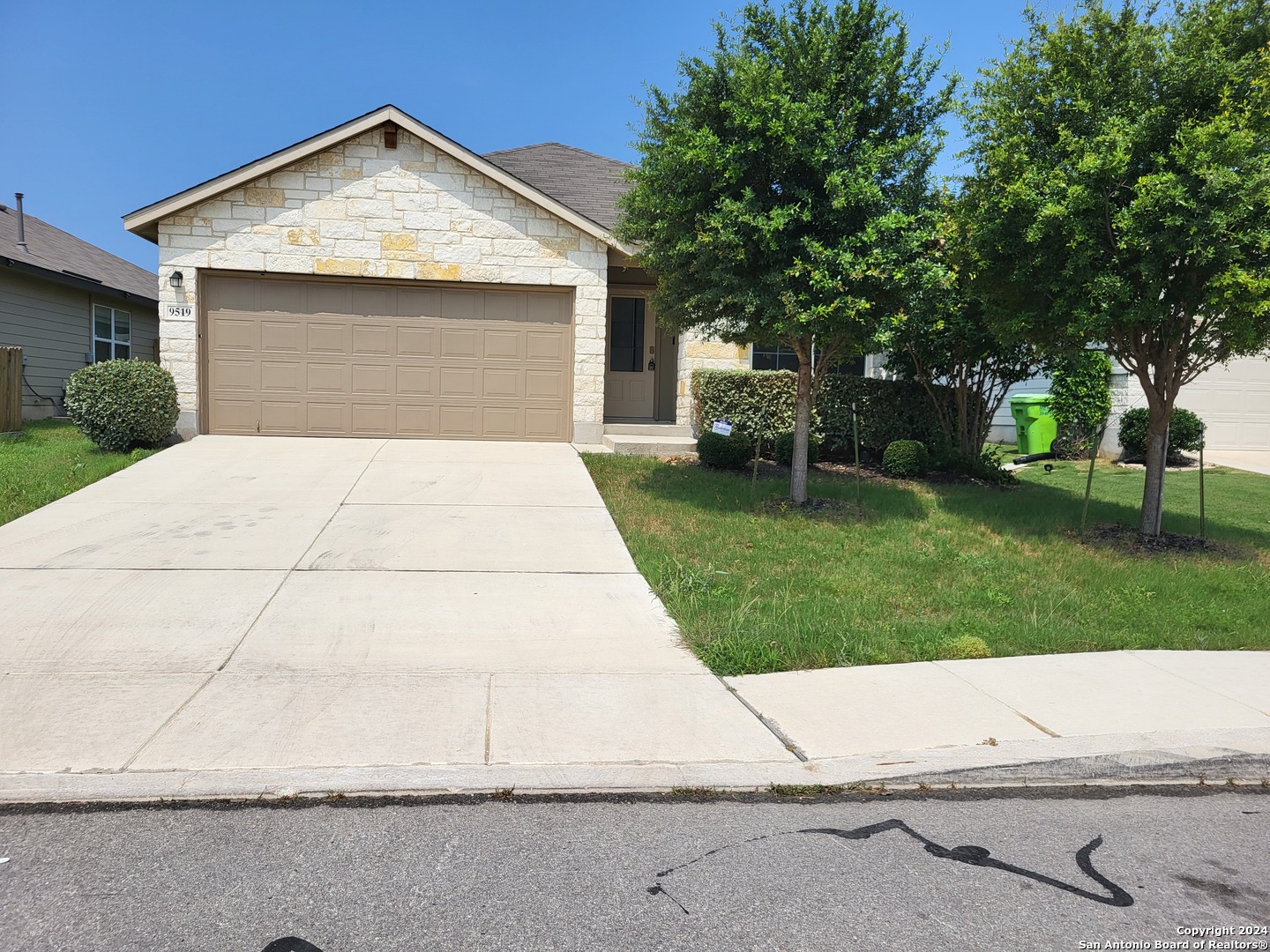 9519 River Rye San Antonio, TX 78254 - Photo 1 of 28 a front view of a house with a garden
