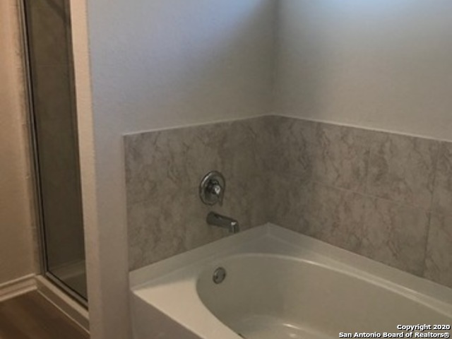 9519 River Rye San Antonio, TX 78254 - Photo 12 of 28 a bathroom with a bathtub