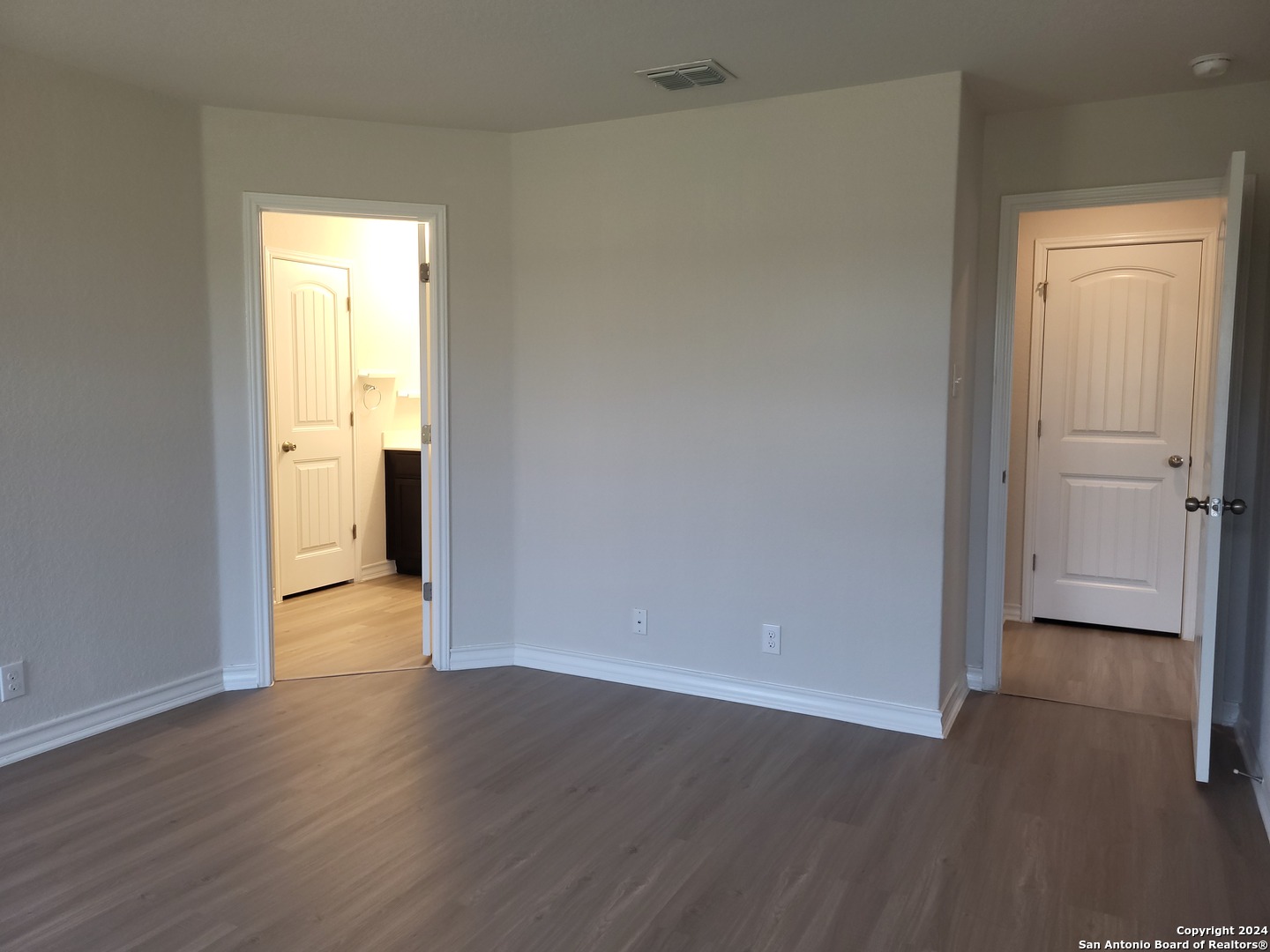 9519 River Rye San Antonio, TX 78254 - Photo 20 of 28 a view of a room with wooden floor and a window