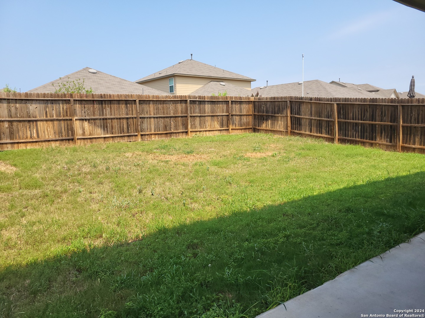 9519 River Rye San Antonio, TX 78254 - Photo 22 of 28 a view of a house with a garden and yard