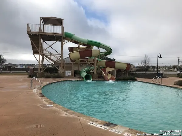 a view of a playground ground and a building