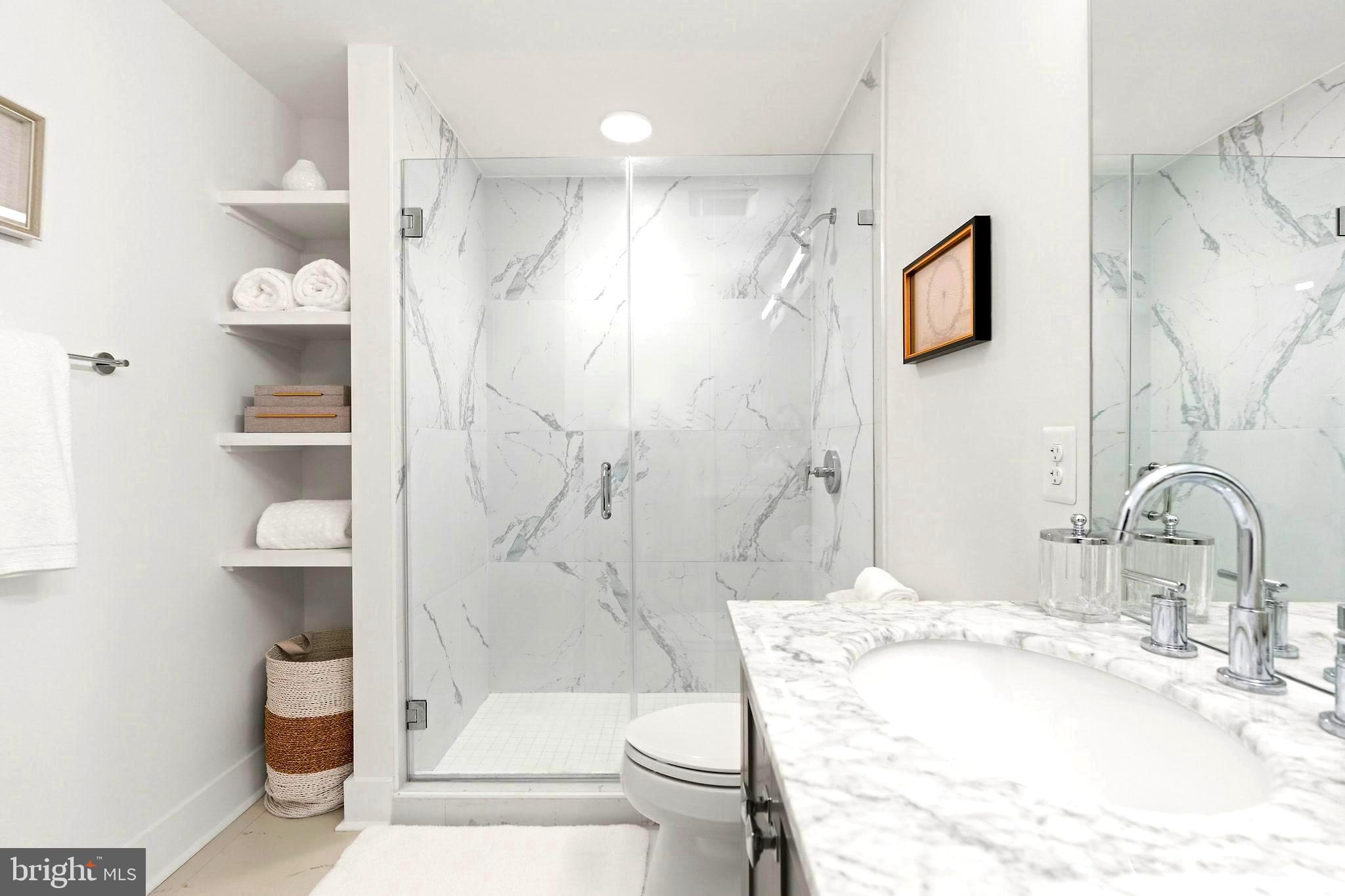2717 Ontario Road Northwest, Unit 102 Washington, DC 20009 - Photo 15 of 32 Frameless glass shower, and high end finishes