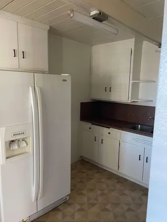 a view of a closet with wooden floor