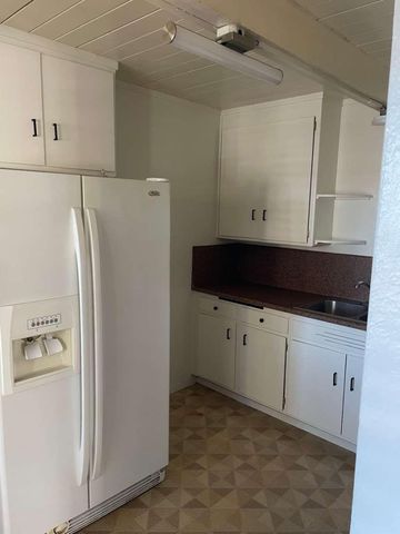 a view of a closet with wooden floor