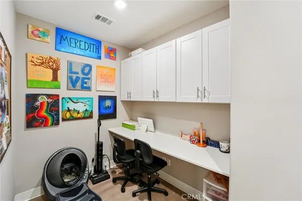 a spacious bathroom with a double vanity sink a large mirror and shower