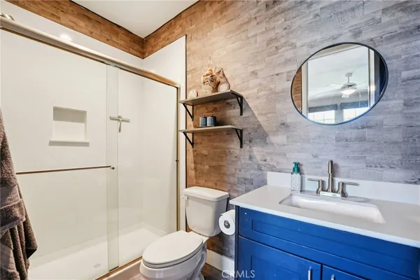 a view of a patio with a table and chairs under an umbrella