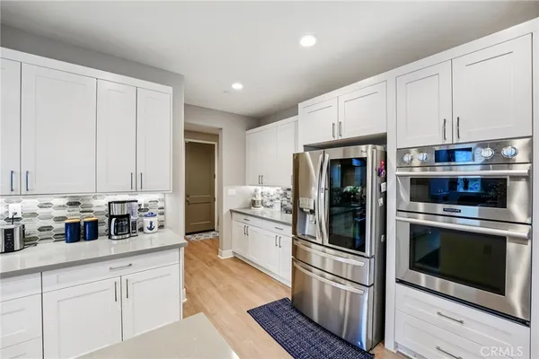 a bathroom with a sink toilet and a mirror